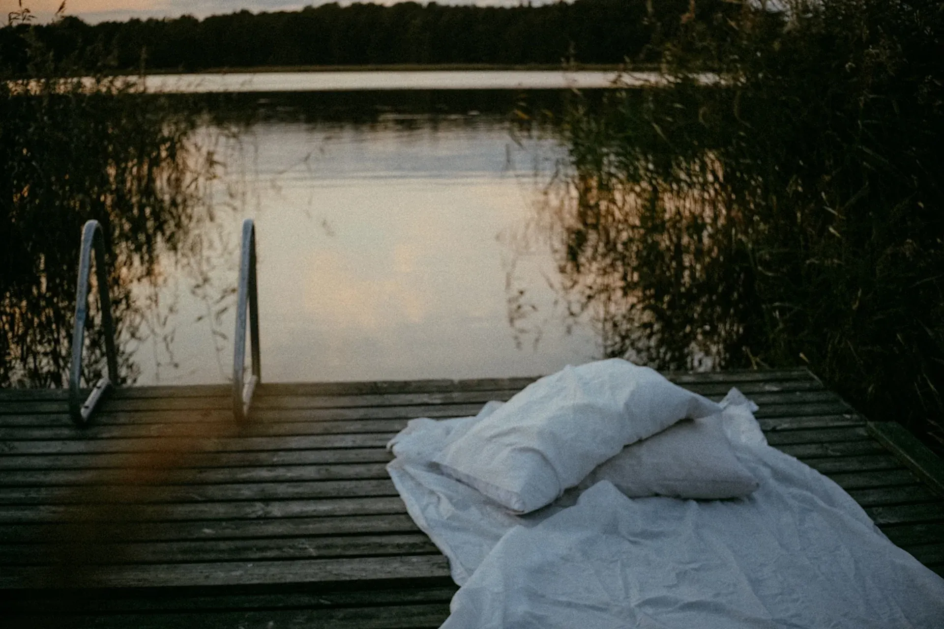 A duvet set up by a lake