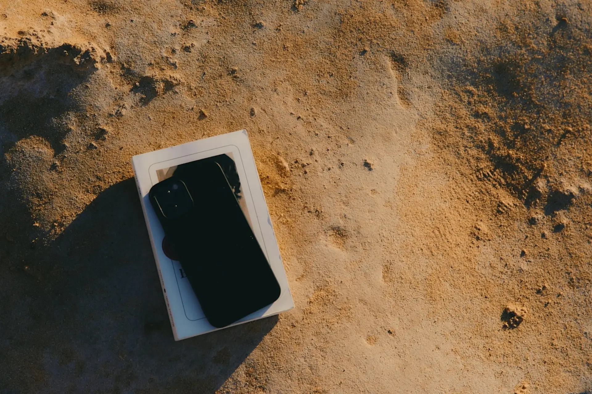 An iPhone on the beach