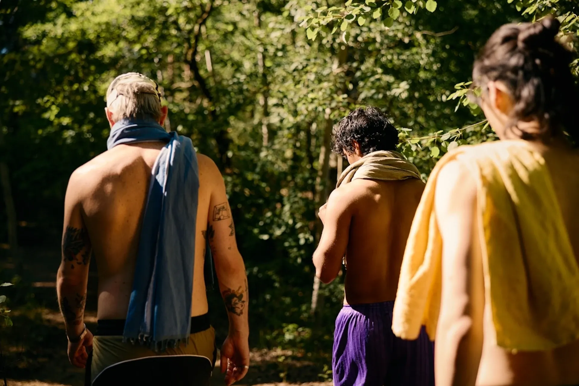 A group of friends coming back from a swim