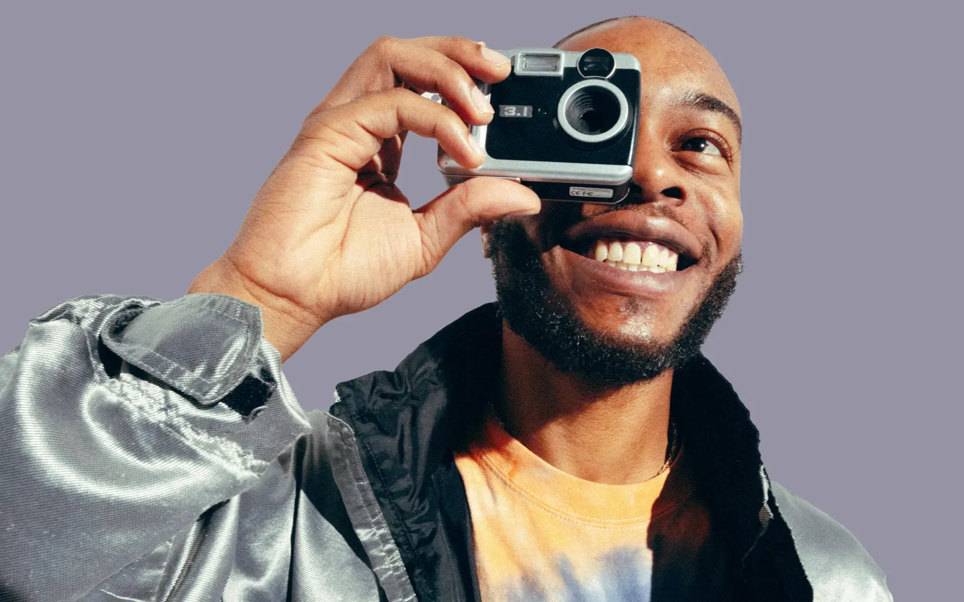 Man taking a photo with an old-school camera