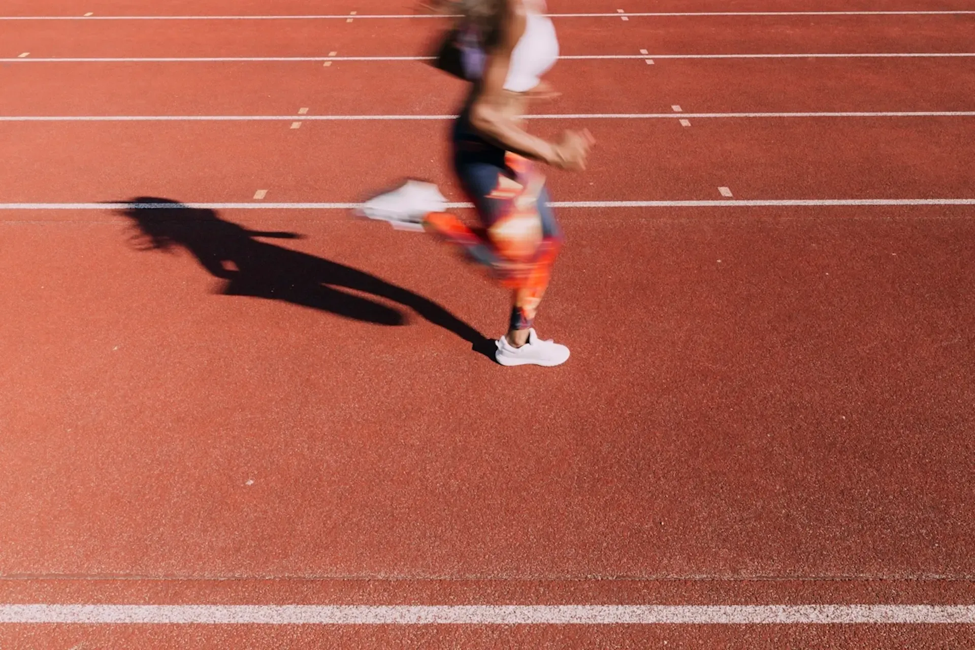 An athlete running on a racing track