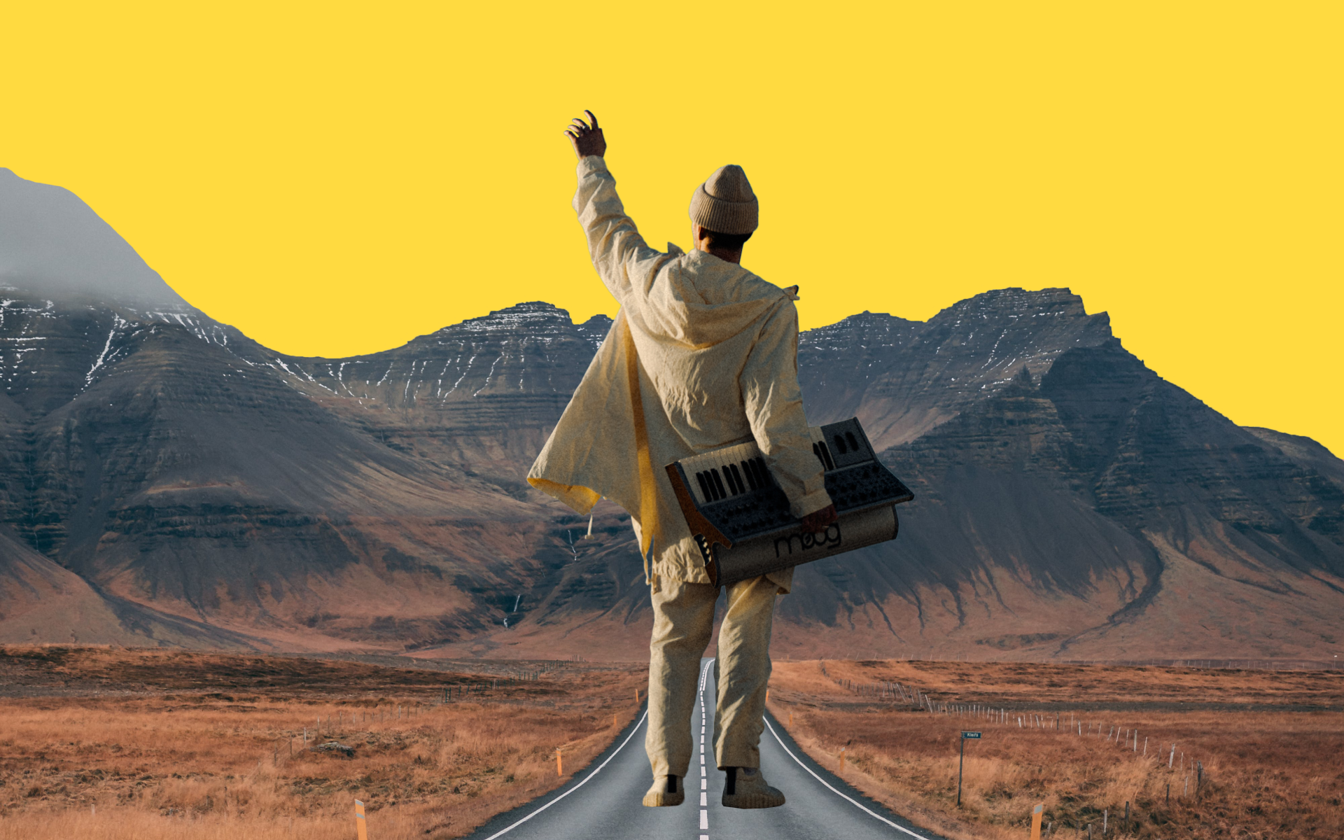 Ooyy stood on a road, surrounded by a mountain range