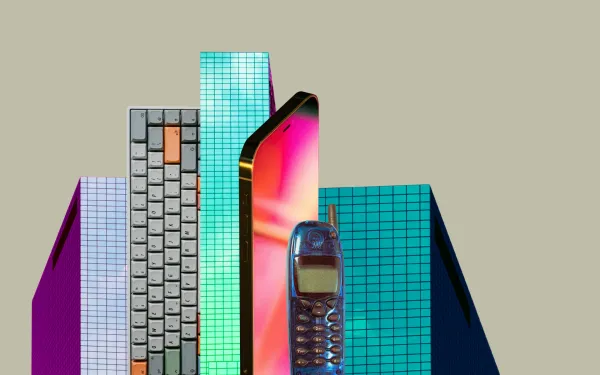 Skyscrapers next to a giant phone and keyboard